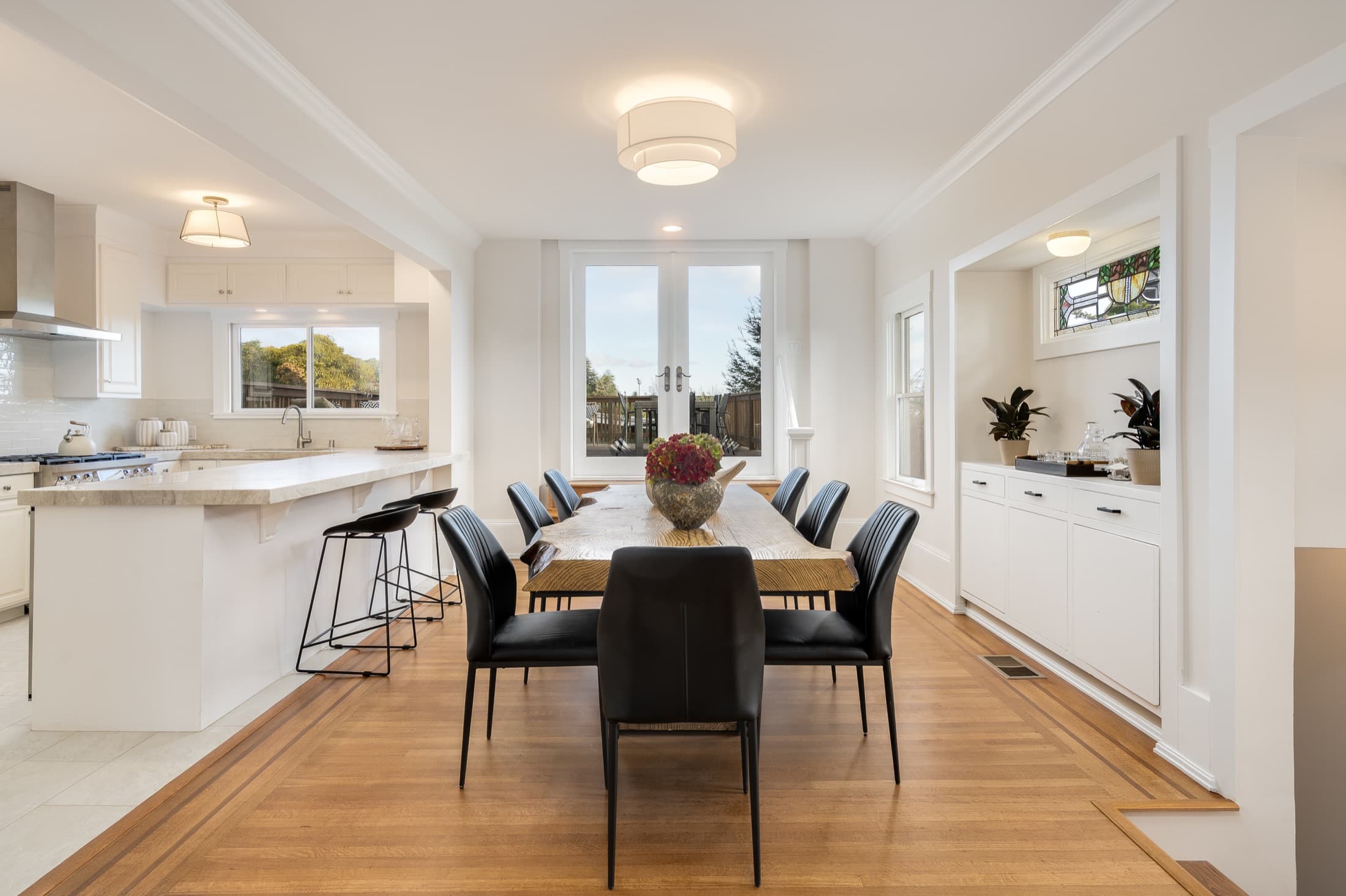 The dining room, open to the kitchen.