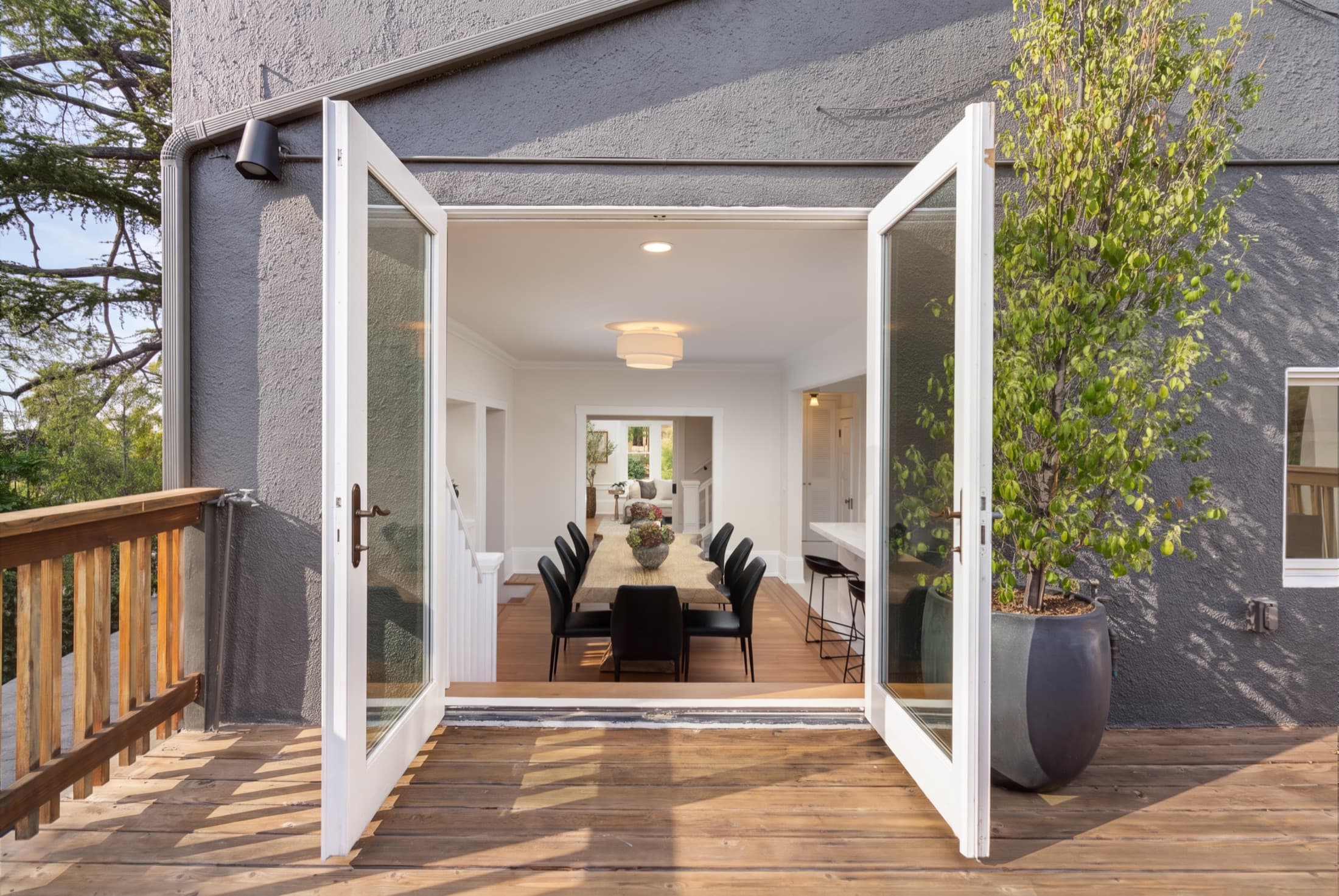 The doors open between deck and dining room.