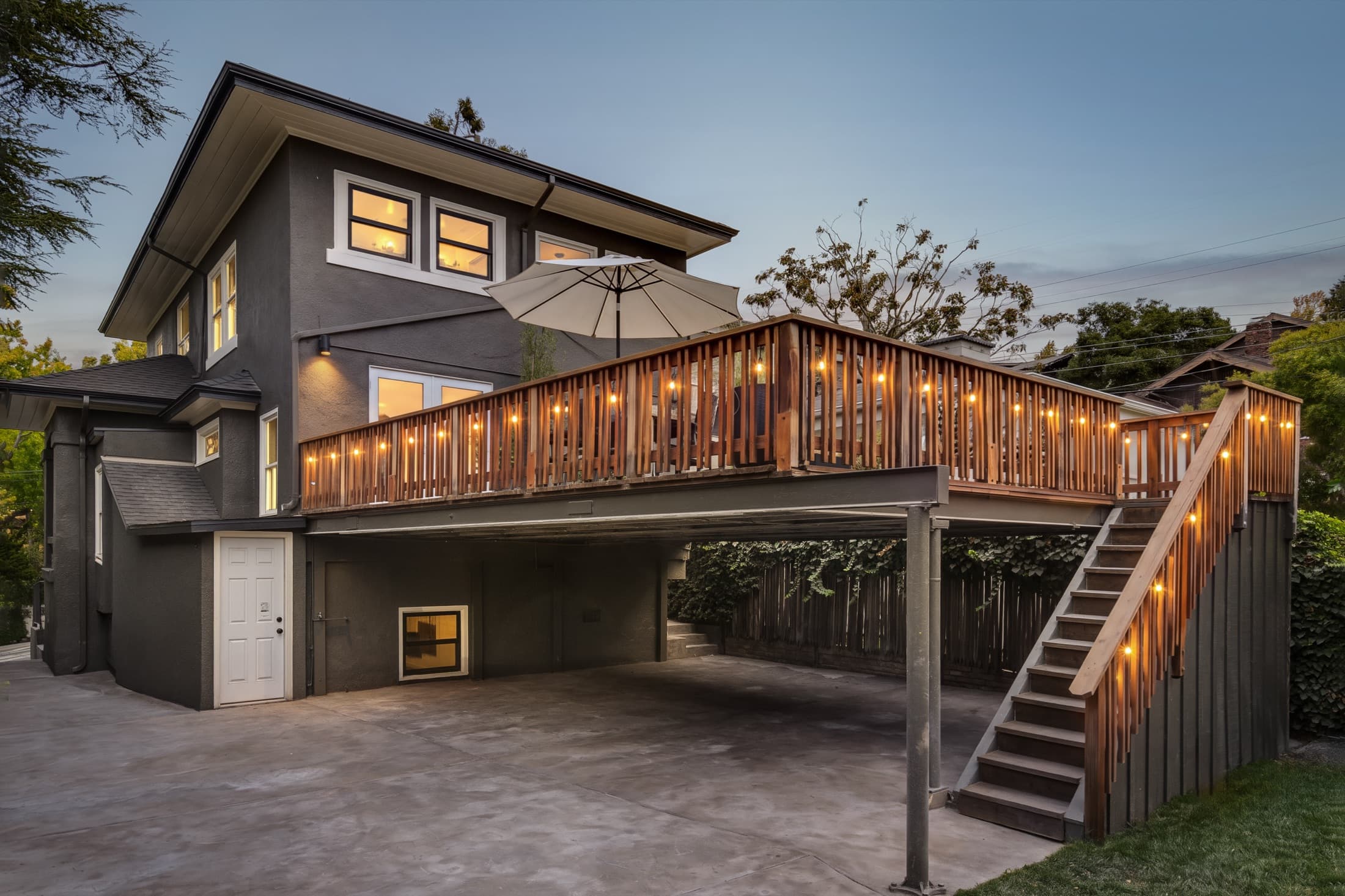 The deck and drive at twilight.
