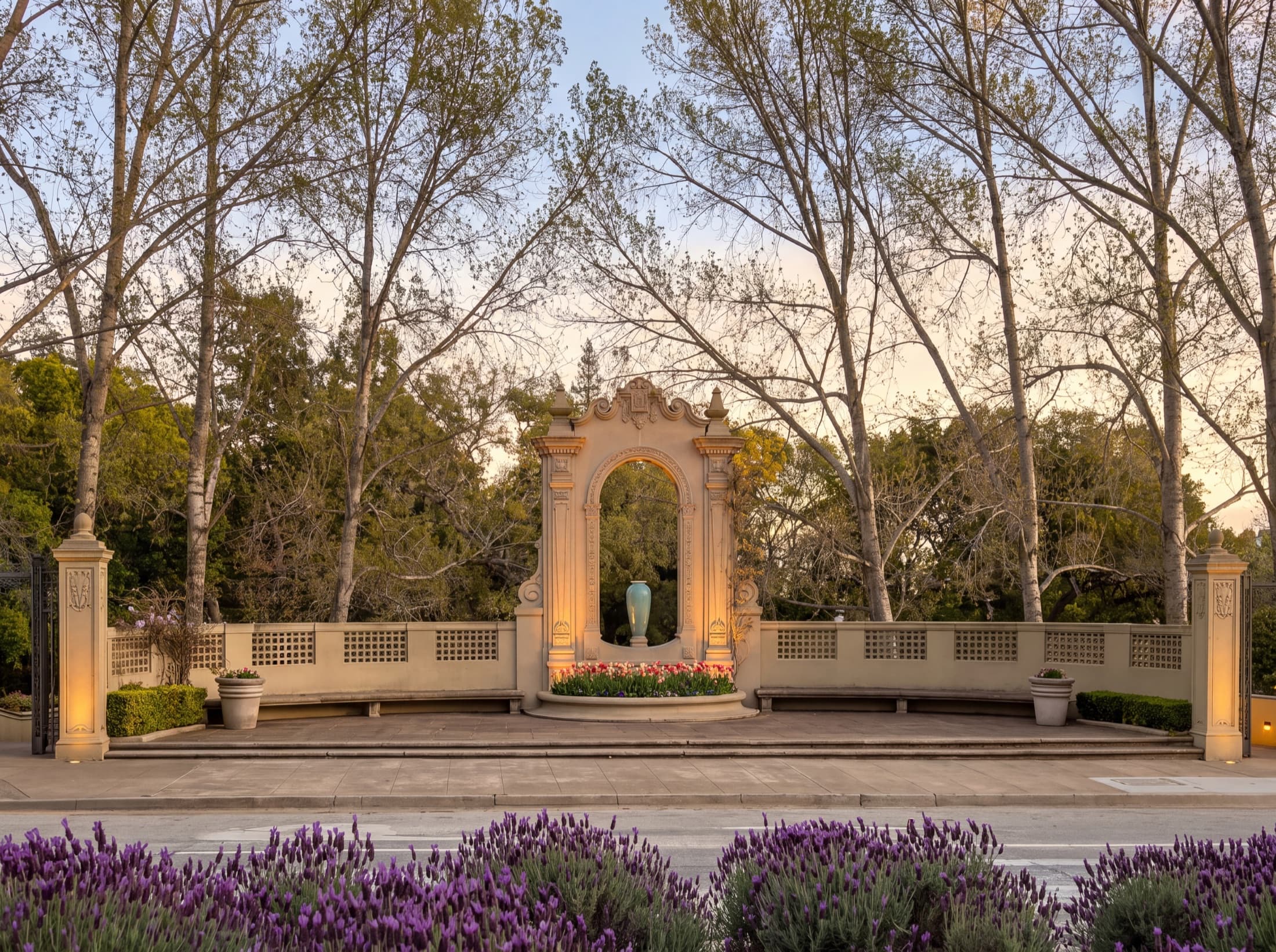 The Exedra monument at Exedra Plaza in Piedmont Park, lit at dusk.